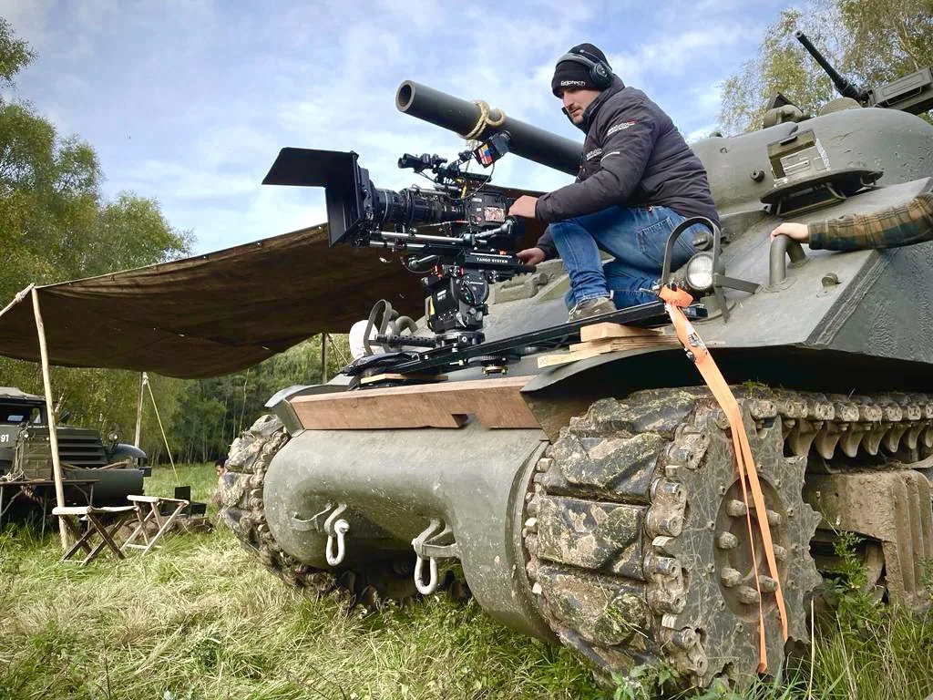 Behind-the-scenes camera setup on a tracked vehicle