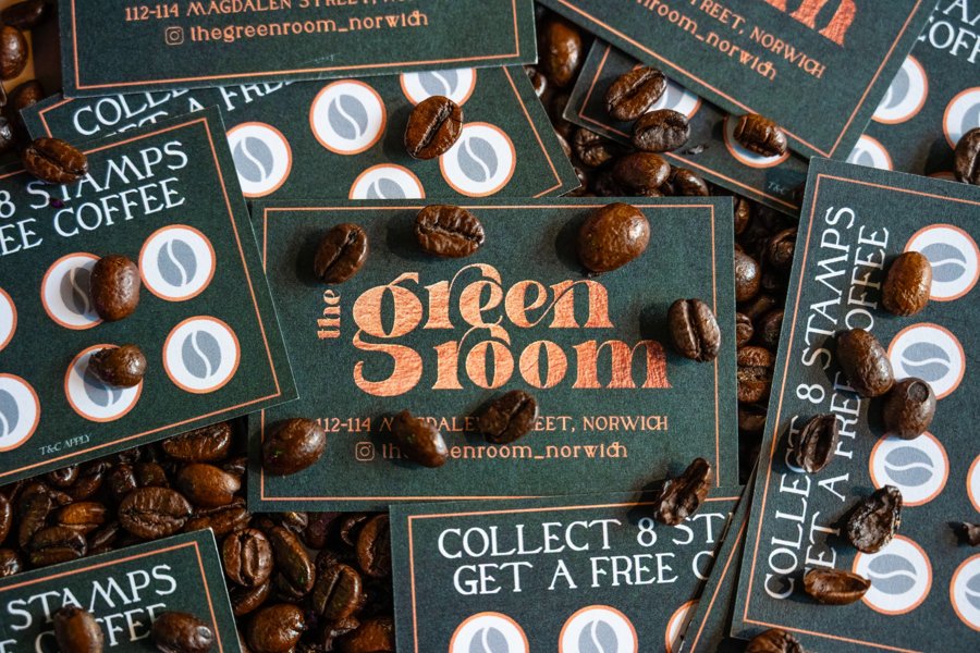 The Green Room Norwich coffee loyalty cards photographed with coffee beans