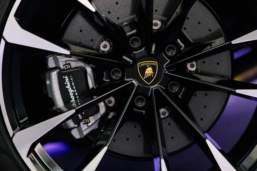 Close-up of a black and silver Lamborghini wheel and brake assembly
